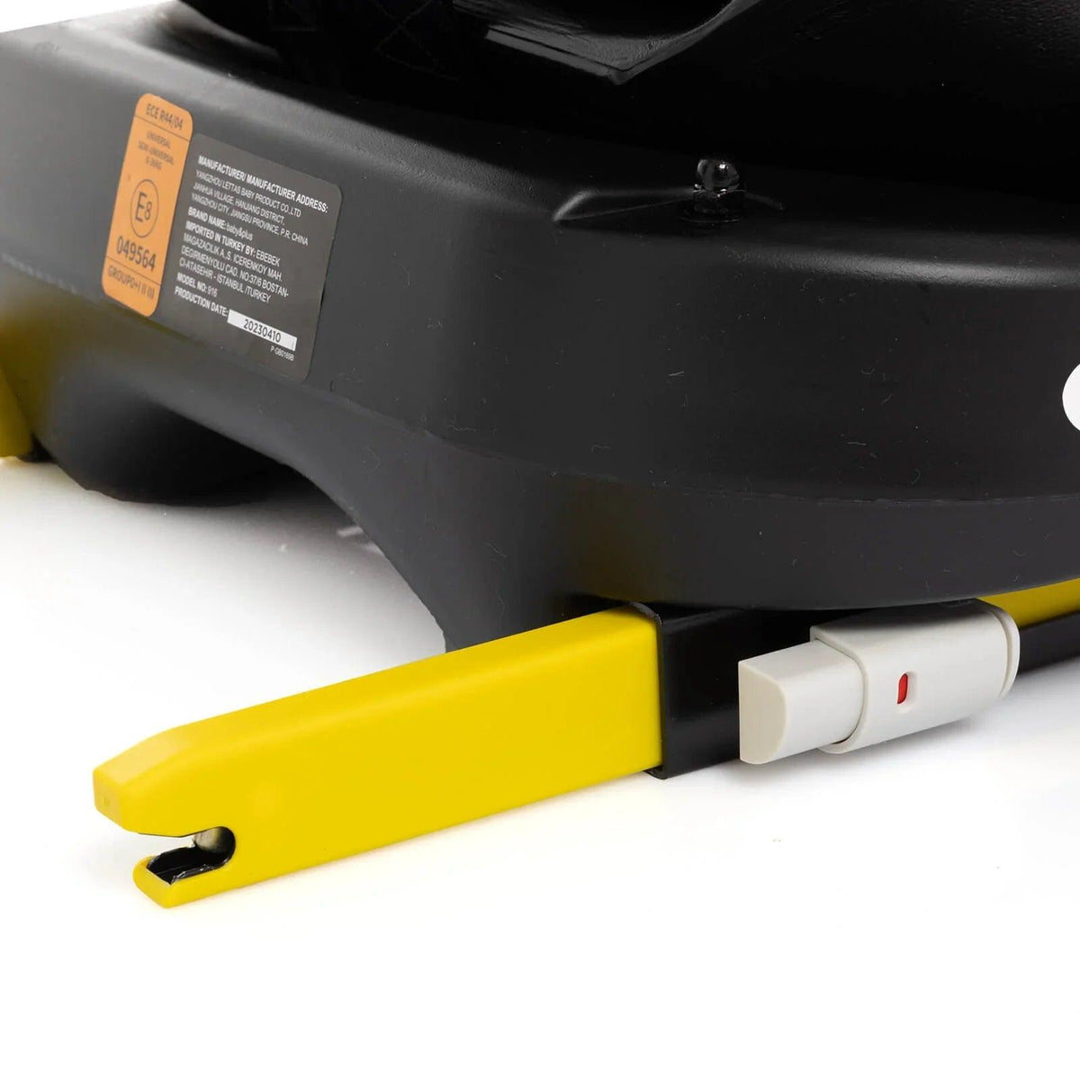 Black car seat base with yellow adjustment handle and white release switch