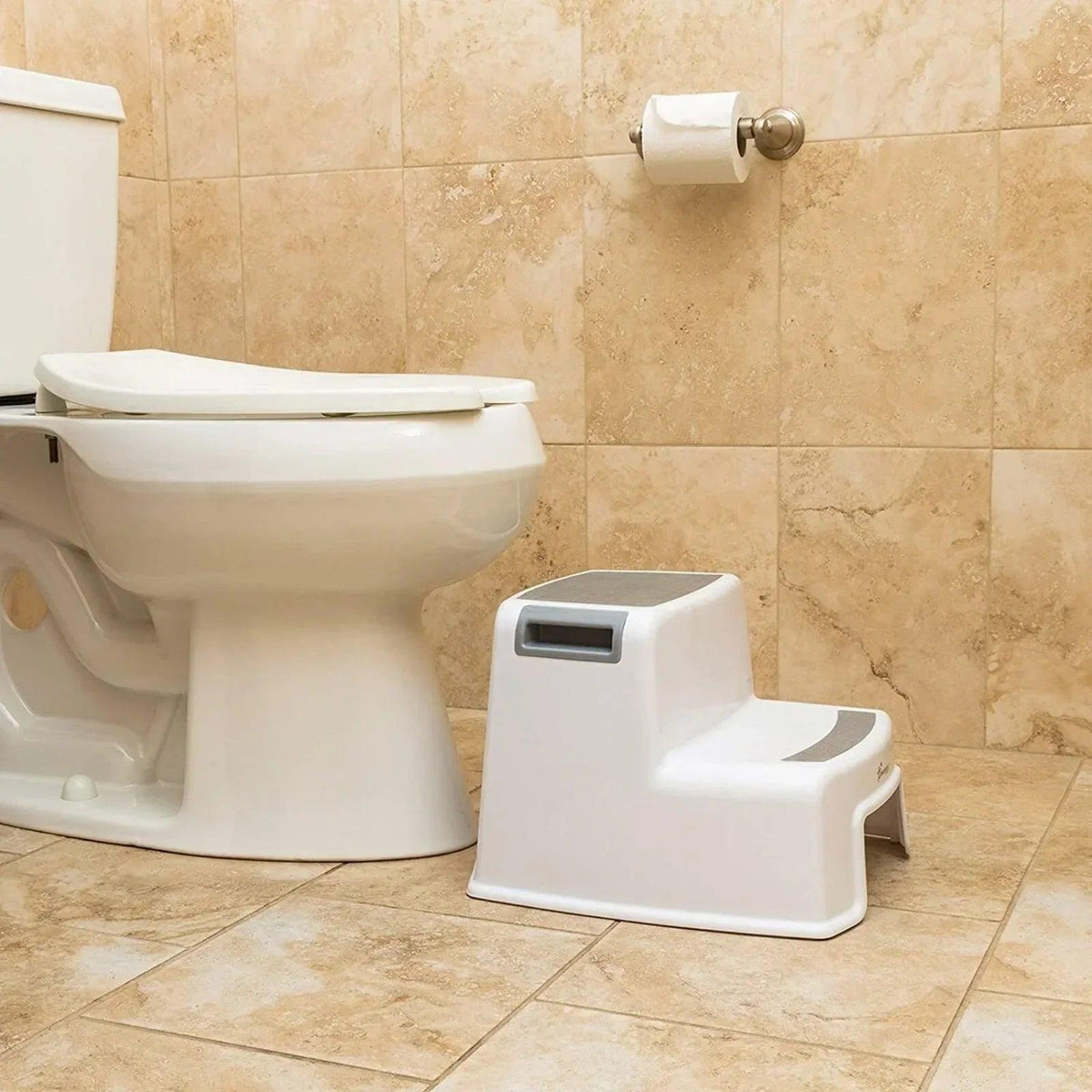 White two-step step stool with textured top platform and side grips in bathroom