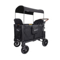 Black stroller wagon with canopy, padded seats, mesh sides, and brown handle bar