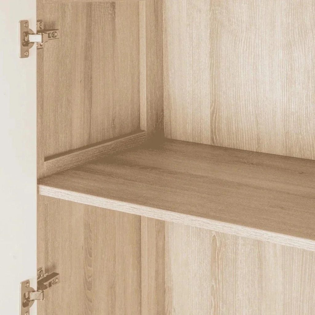 Oak wardrobe interior with an open door and built-in shelf with raised front edge