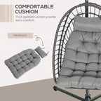 Hanging egg swing chair with thick light grey cushion and matching headrest pillow