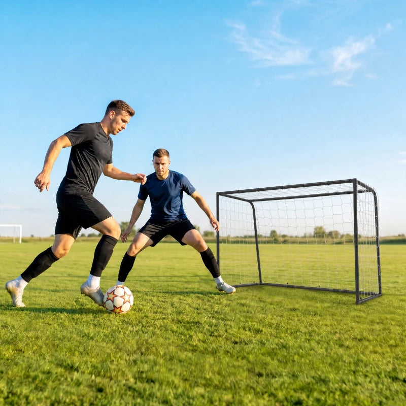 Black football goal with white net, soccer ball in front on field