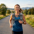 Grey weighted vest on runner, front straps and reflective bands