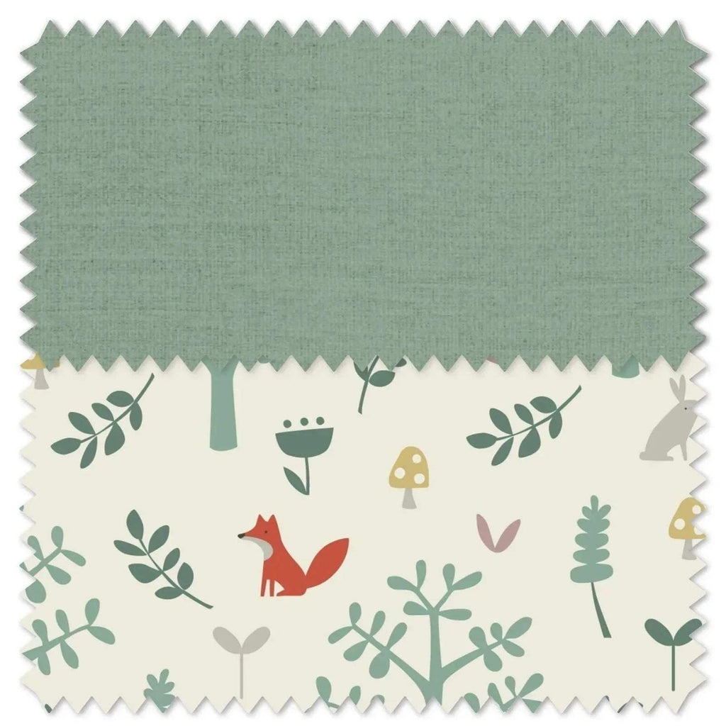 Fabric swatch in light teal with woodland animals, trees, and decorative shapes