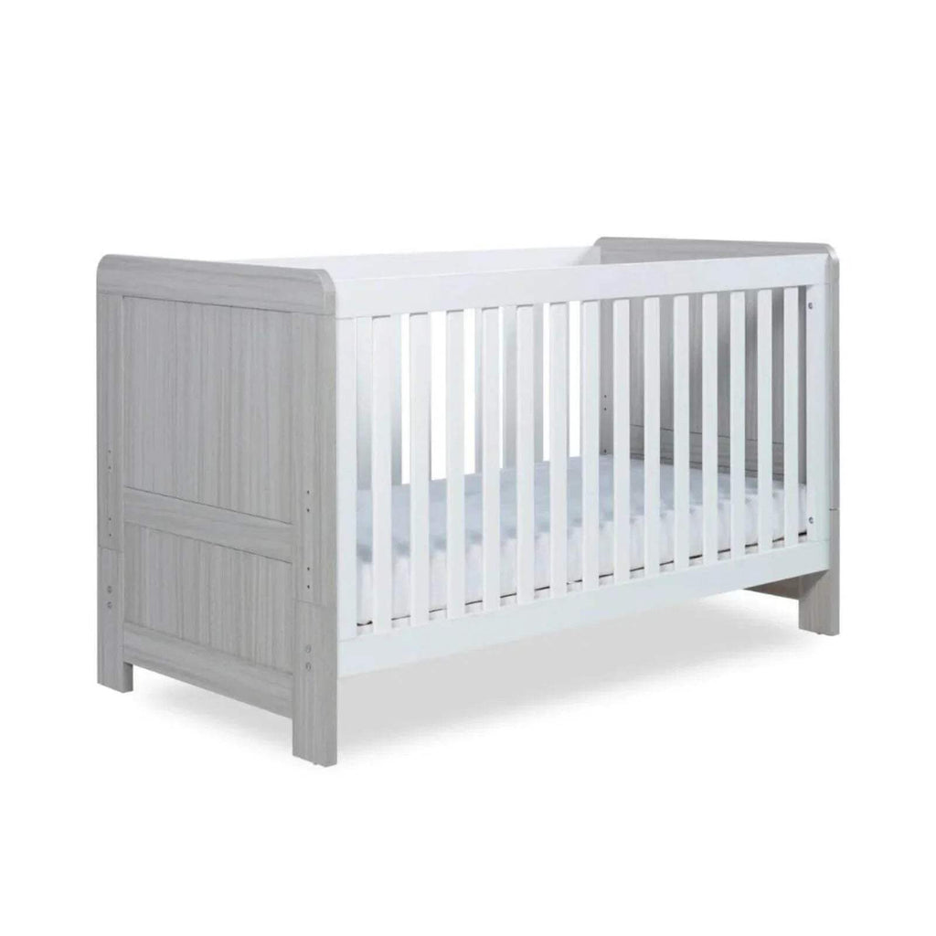 Ash grey cot bed with white slatted sides and low foot-end design