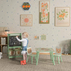 Kids art easel and two matching table chairs with bear designs in a playroom.
