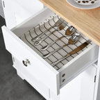 White drawer organizer with a slotted metal rack for utensils