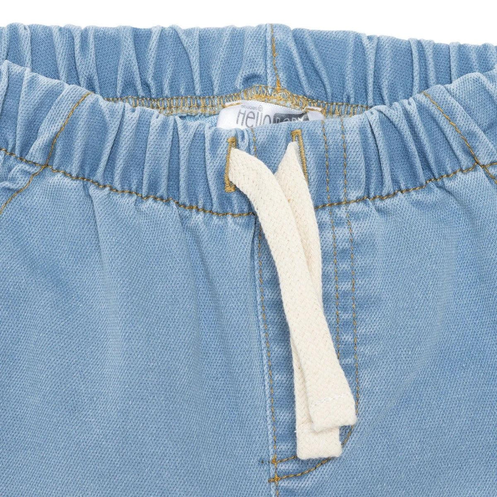 Light blue denim baby trousers waistband with fabric drawstring and stitched seams