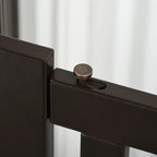Close-up of latch on dark brown slatted dog gate