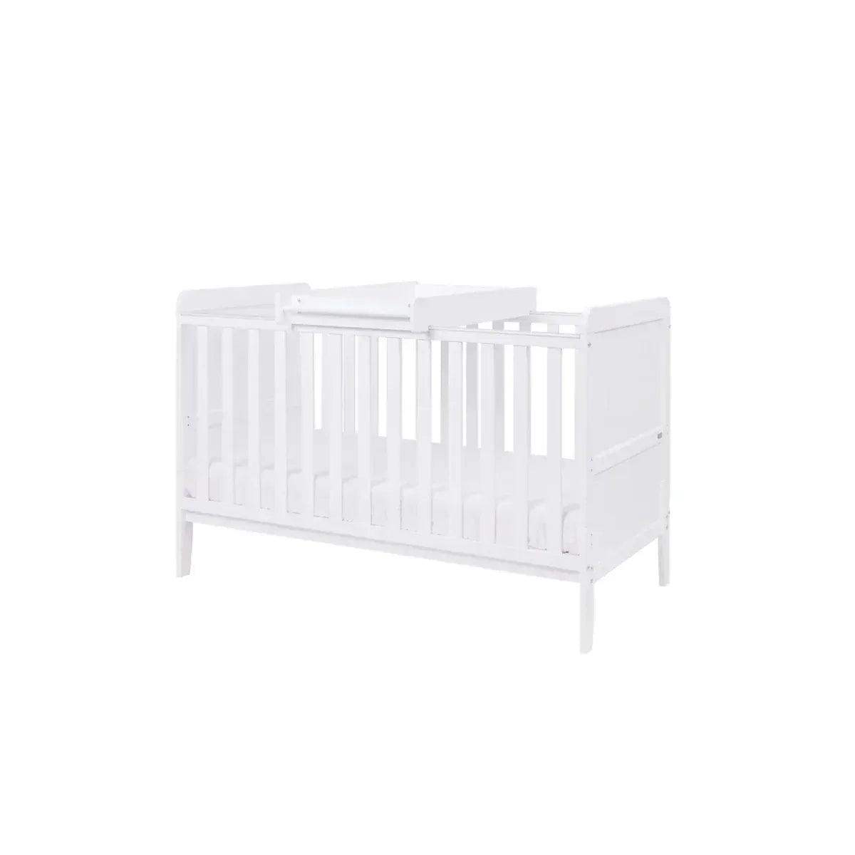 White cot bed with vertical slat sides and protective rail on ends