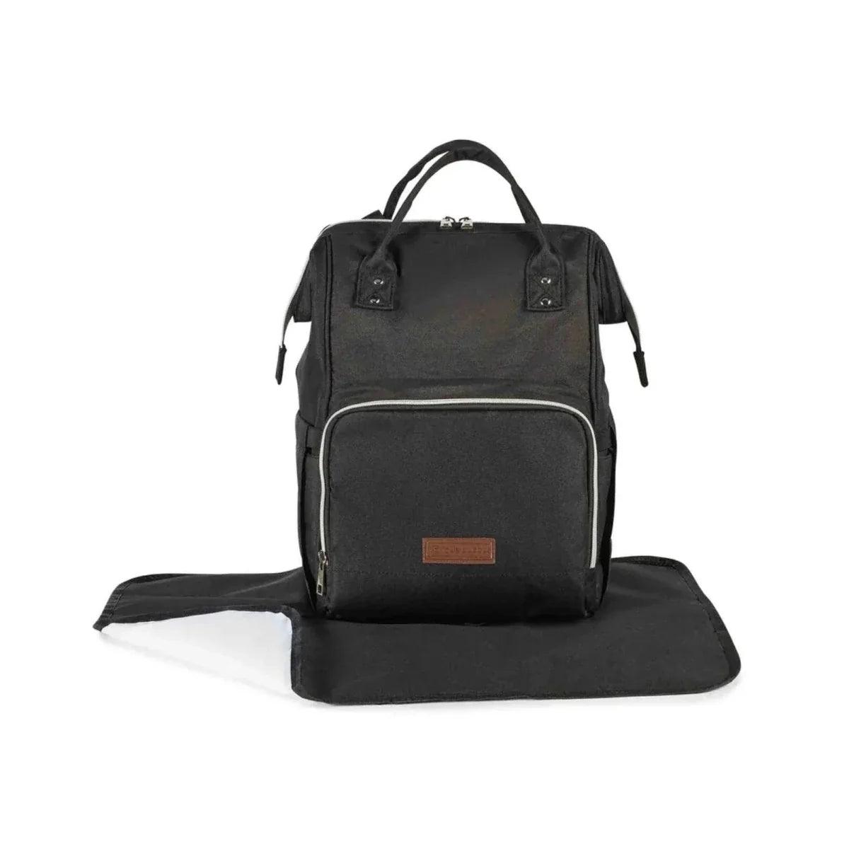 Black travel backpack with front pocket, zippers, and tan logo patch