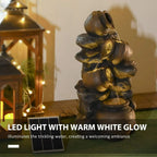 Warm-lit dark grey and gold cascading jar water fountain with illuminated water feature