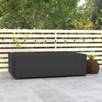 Black rectangular outdoor patio furniture cover protecting sofa on stone patio