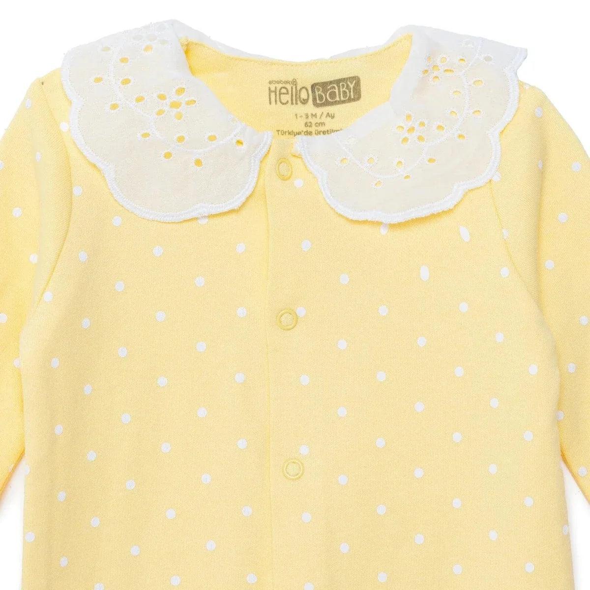 Yellow polka-dot baby sleepsuit with white scalloped collar and button placket