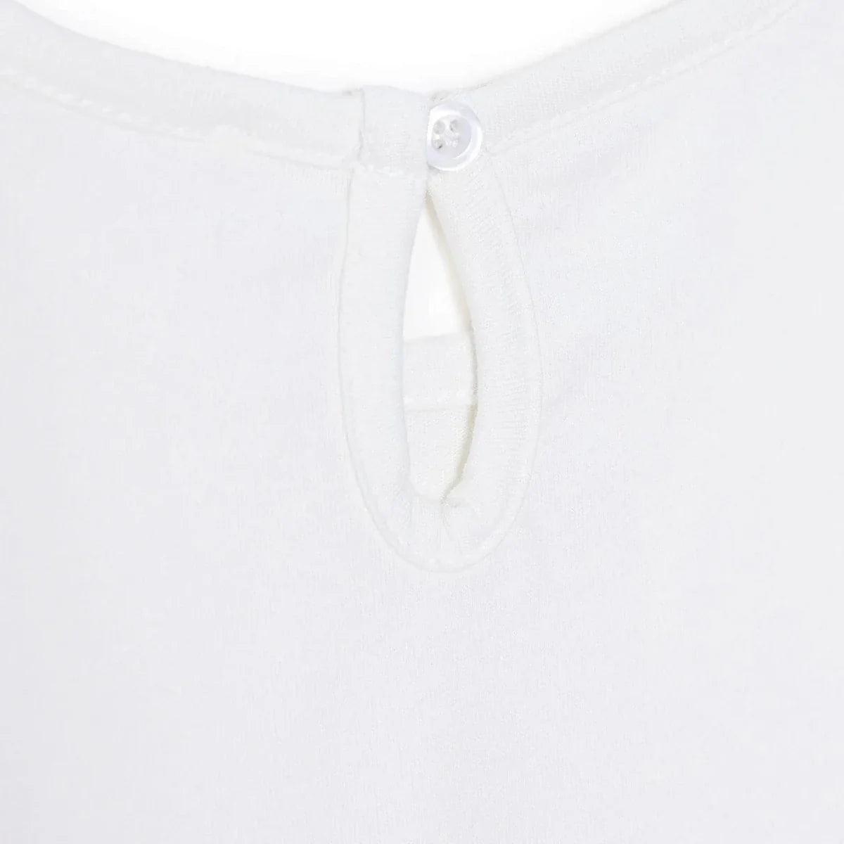 Off-white blouse with buttoned keyhole neckline and hidden placket.