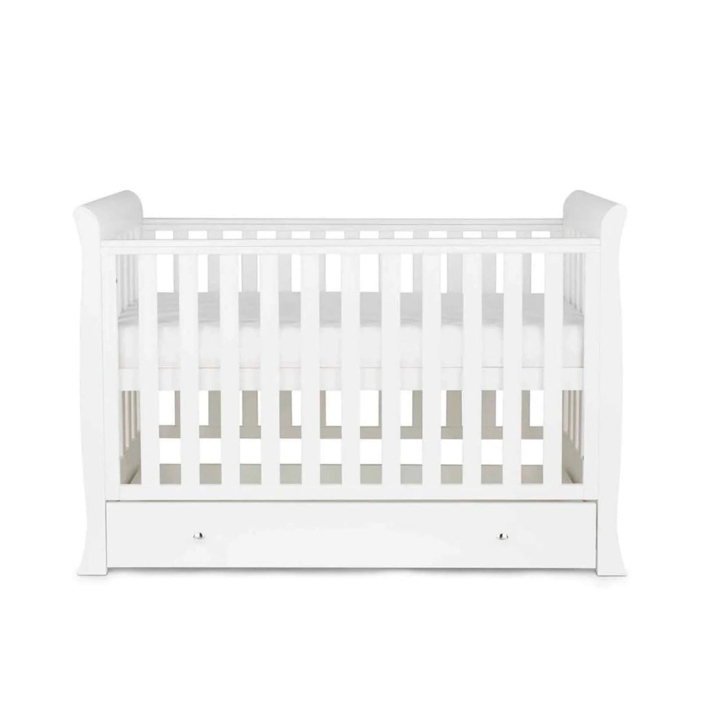 White mini cot front view with slatted sides and drawer
