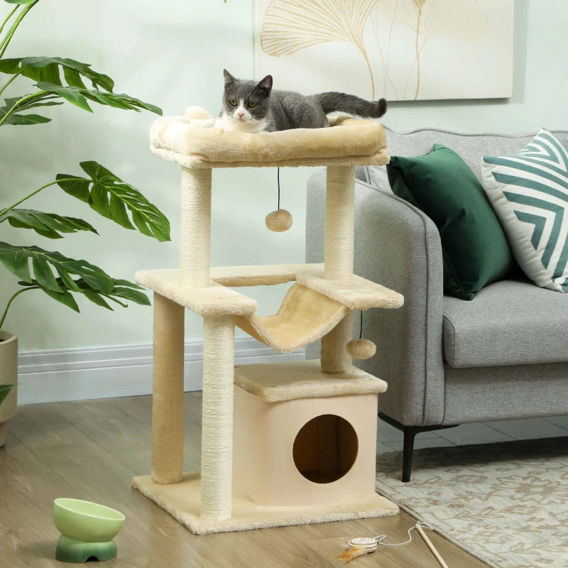 Beige cat tower with top perch, hammock, condo house, and hanging balls