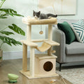 Beige cat tower with top perch, hammock, condo house, and hanging balls