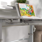Grey open storage area under adjustable kids desk tabletop