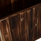 Close-up of dark carbonized wooden side boards on a raised garden bed