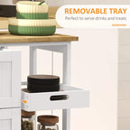 White cart with wood top and removable serving tray above open drawer storage.