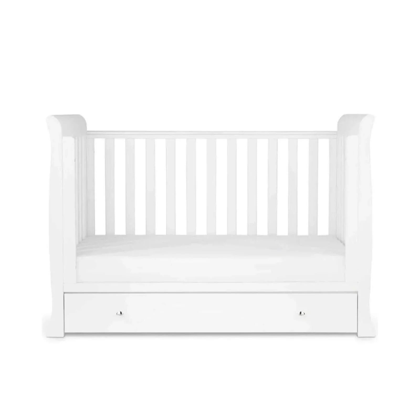 White toddler bed with slatted rails and front drawer panel, empty mattress area