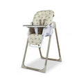 Baby highchair with cream animal print seat, white frame, tray, and safety straps.
