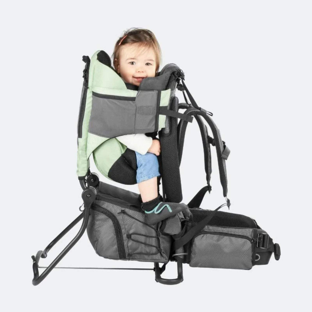 Sage green baby carrier with mesh seat, adjustable straps, and padded footrest