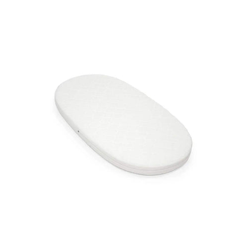 White oval bed mattress with smooth surface and rounded edges