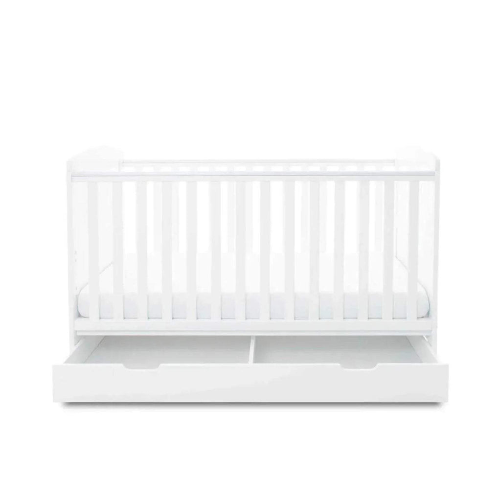 White cot bed with front rail and under-drawer pulled open