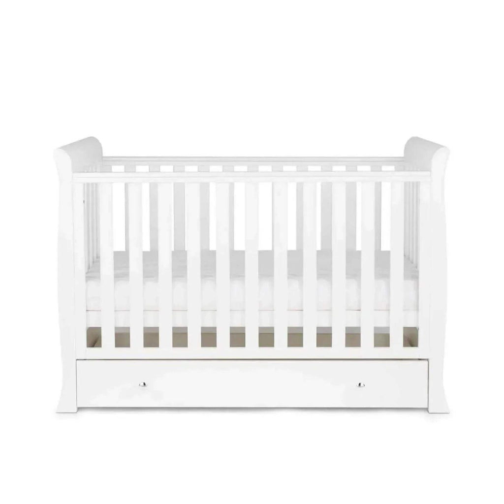White baby crib with slatted rails and single drawer front panel