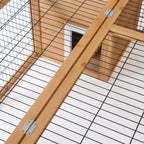 Metal hinge hardware on wooden roof beam for a rabbit hutch run cage