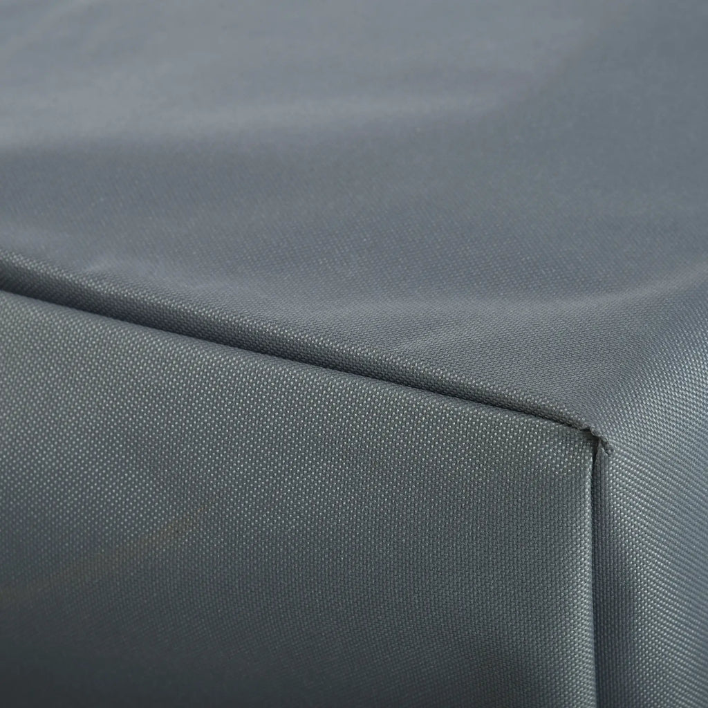 Close-up of stitched seams and woven gray cover fabric