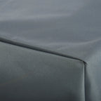 Close-up of stitched seams and woven gray cover fabric