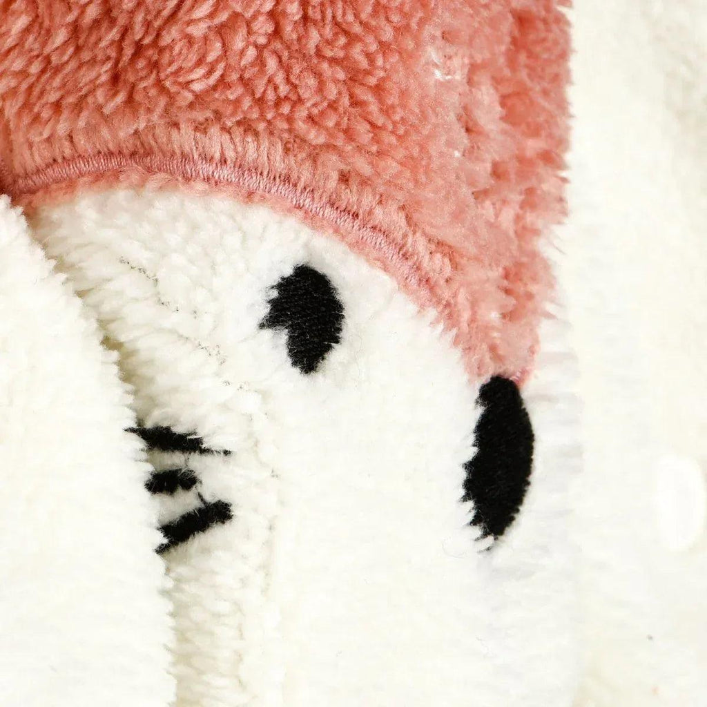 Fox face detail on cream panel with black embroidered eyes and whiskers.