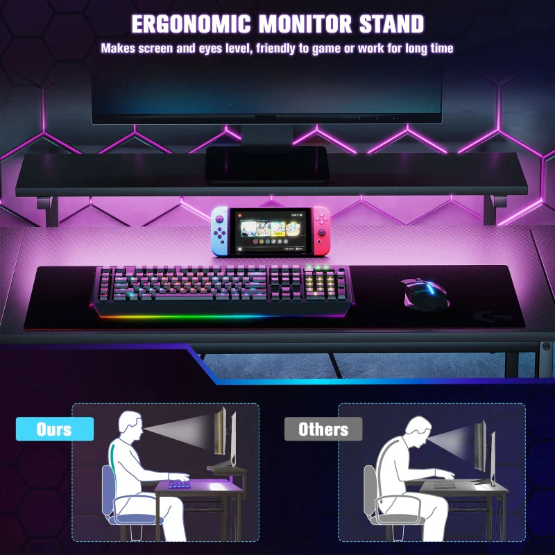 Black desk setup with ergonomic monitor stand and colorful RGB lighting