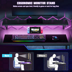 Black desk setup with ergonomic monitor stand and colorful RGB lighting