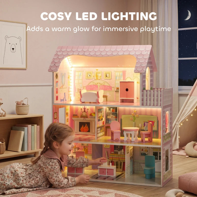 Pink dollhouse with warm LED lighting, glowing windows, and detailed interior rooms.