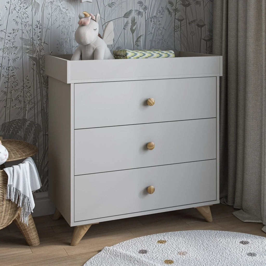 Kids changing dresser in grey with 3 drawers and brass round knobs, front view