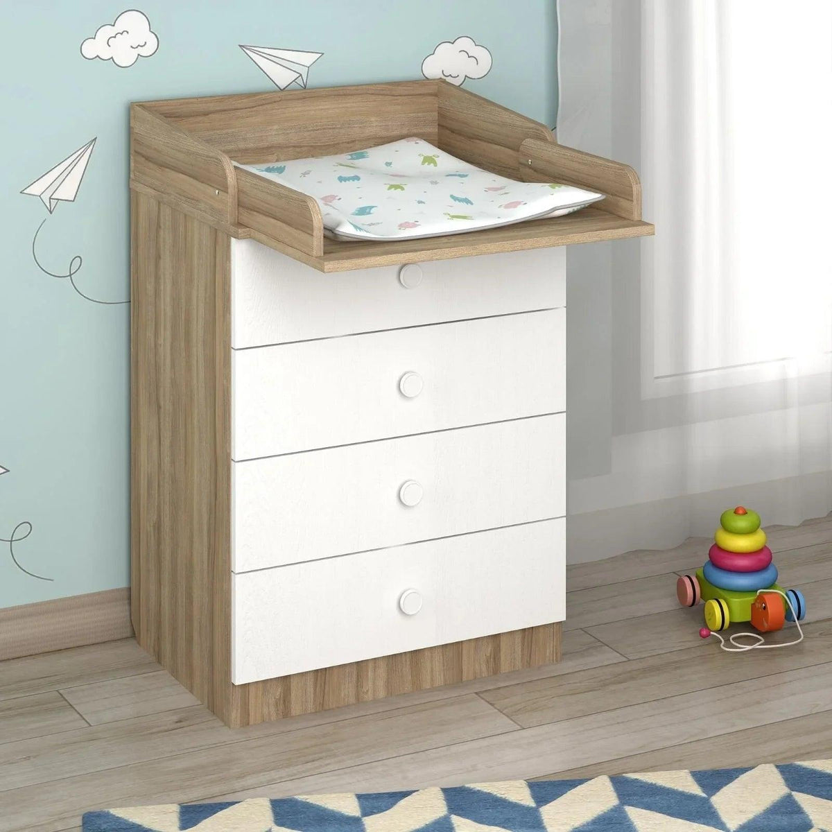 Kids changing dresser with elm side panels, white drawers, and built-in changing pad