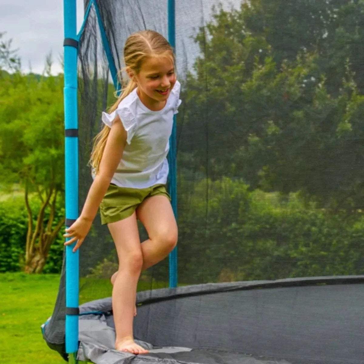Outdoor trampoline with safety net, gray jumping mat, and blue support poles