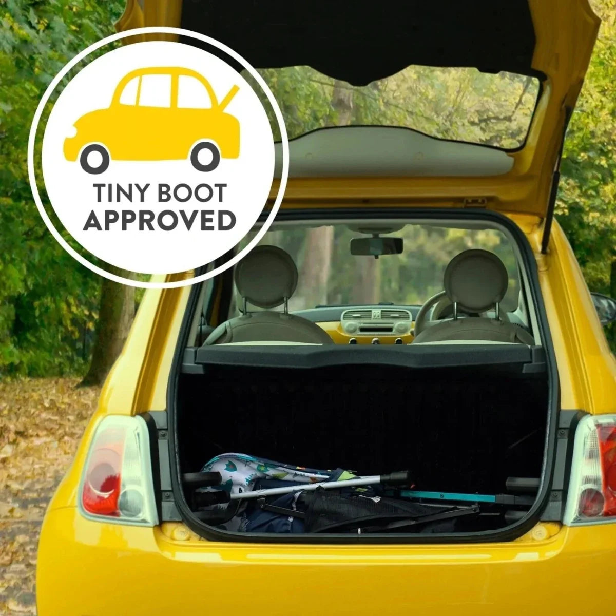 Tiny Boot Approved badge over car trunk showing stroller storage compartment
