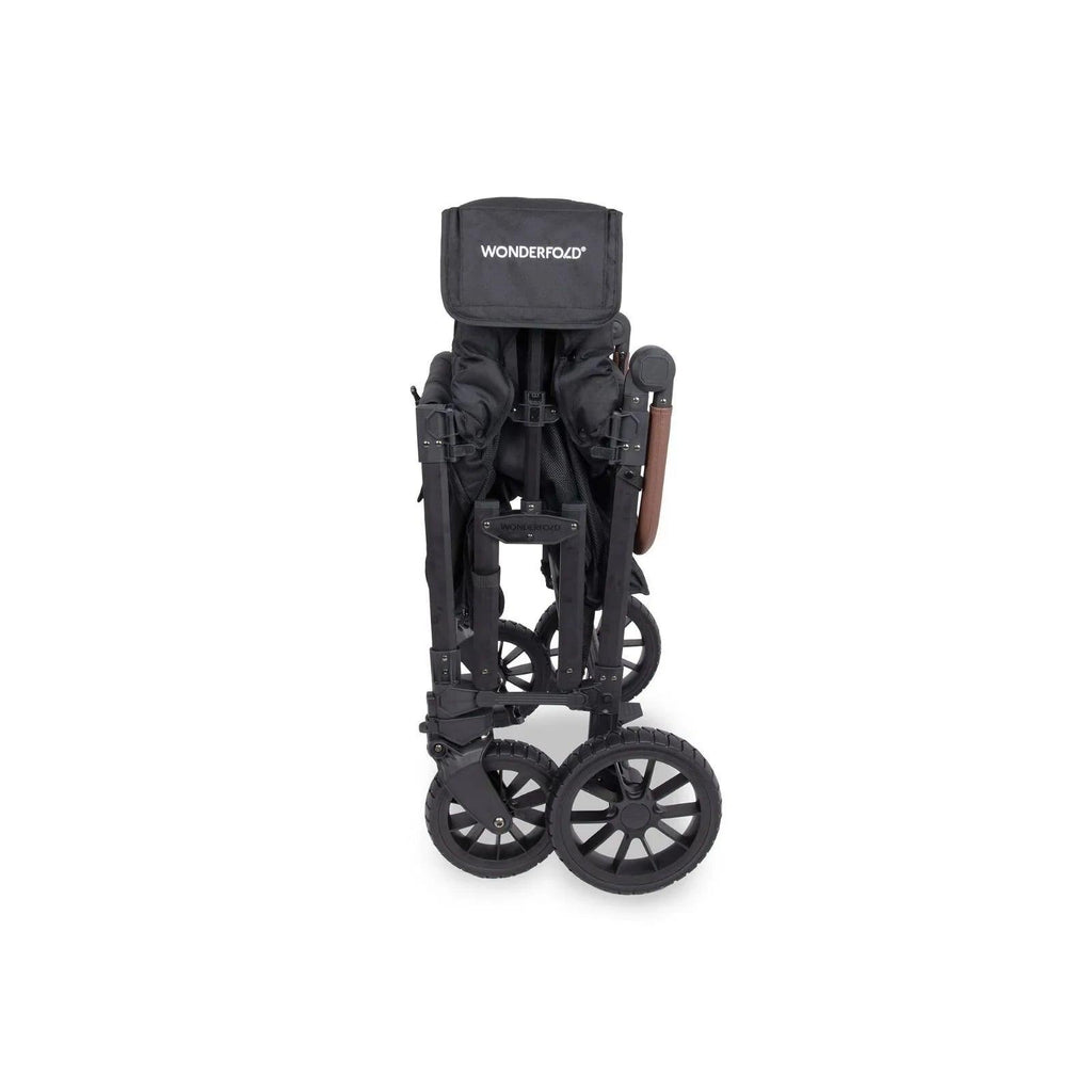 Black stroller wagon with canopy and footrest area, shown with standing frame