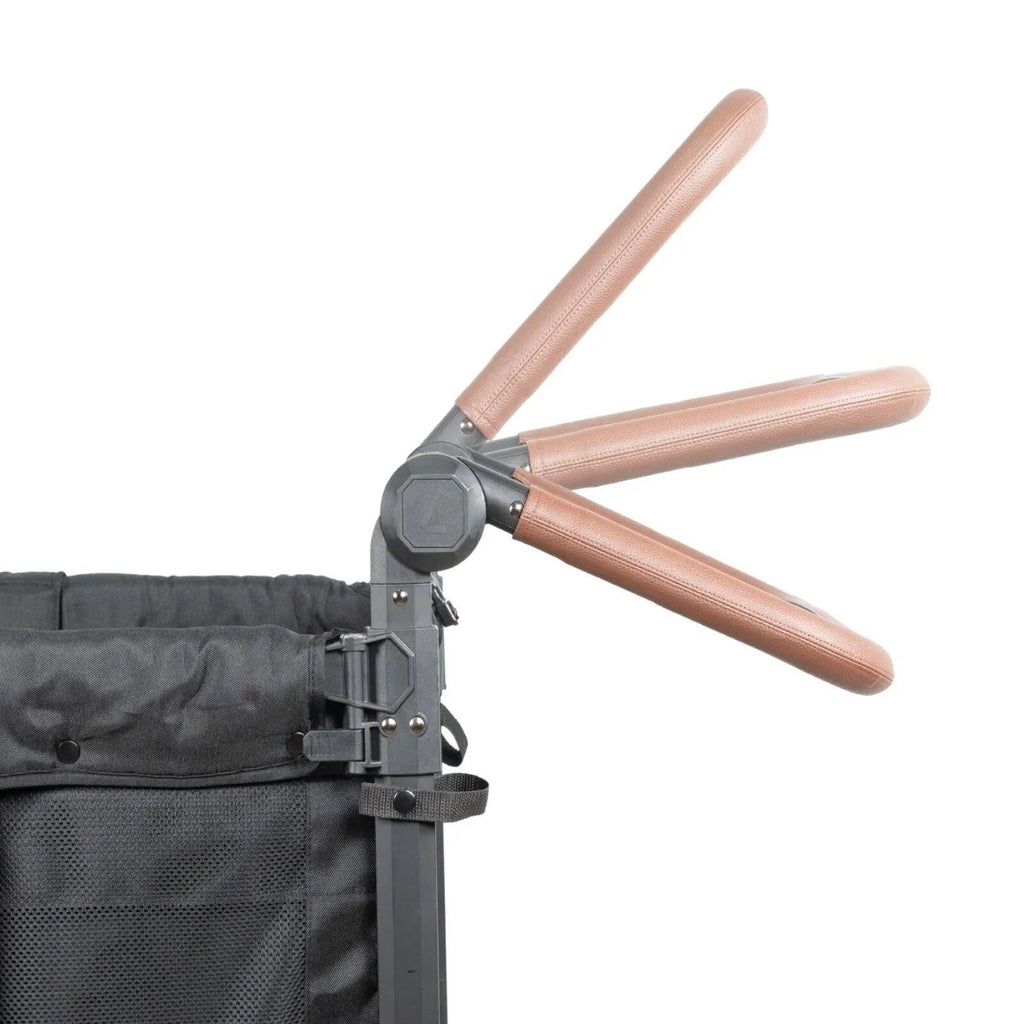 Jet black stroller wagon with rose-gold handlebar and latch hardware near front