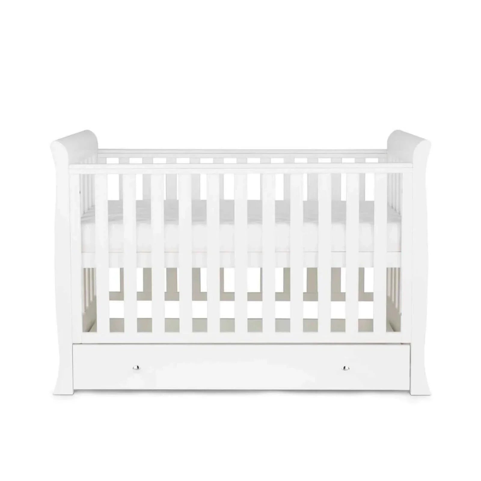 White mini cot bed with vertical slat rails, open interior, and front drawer