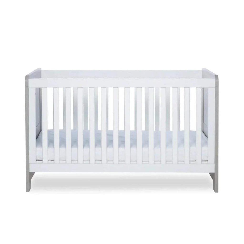 White slatted cot bed interior view with light grey frame posts