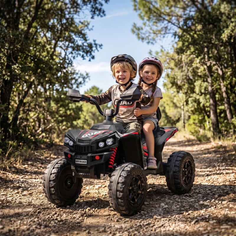 Kids electric 2-seat quad bike in black, two riders, chunky tires on gravel road