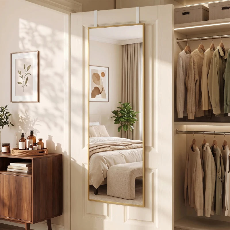 Rectangular wall mirror with gold-tone frame, reflecting room interior.