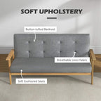 Dark grey linen sofa with button-tufted backrest and soft cushioned seat