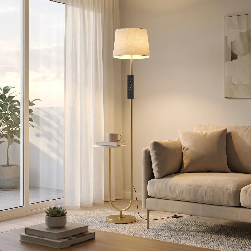 Gold-tone floor lamp with linen shade and round side shelf, U-shaped base